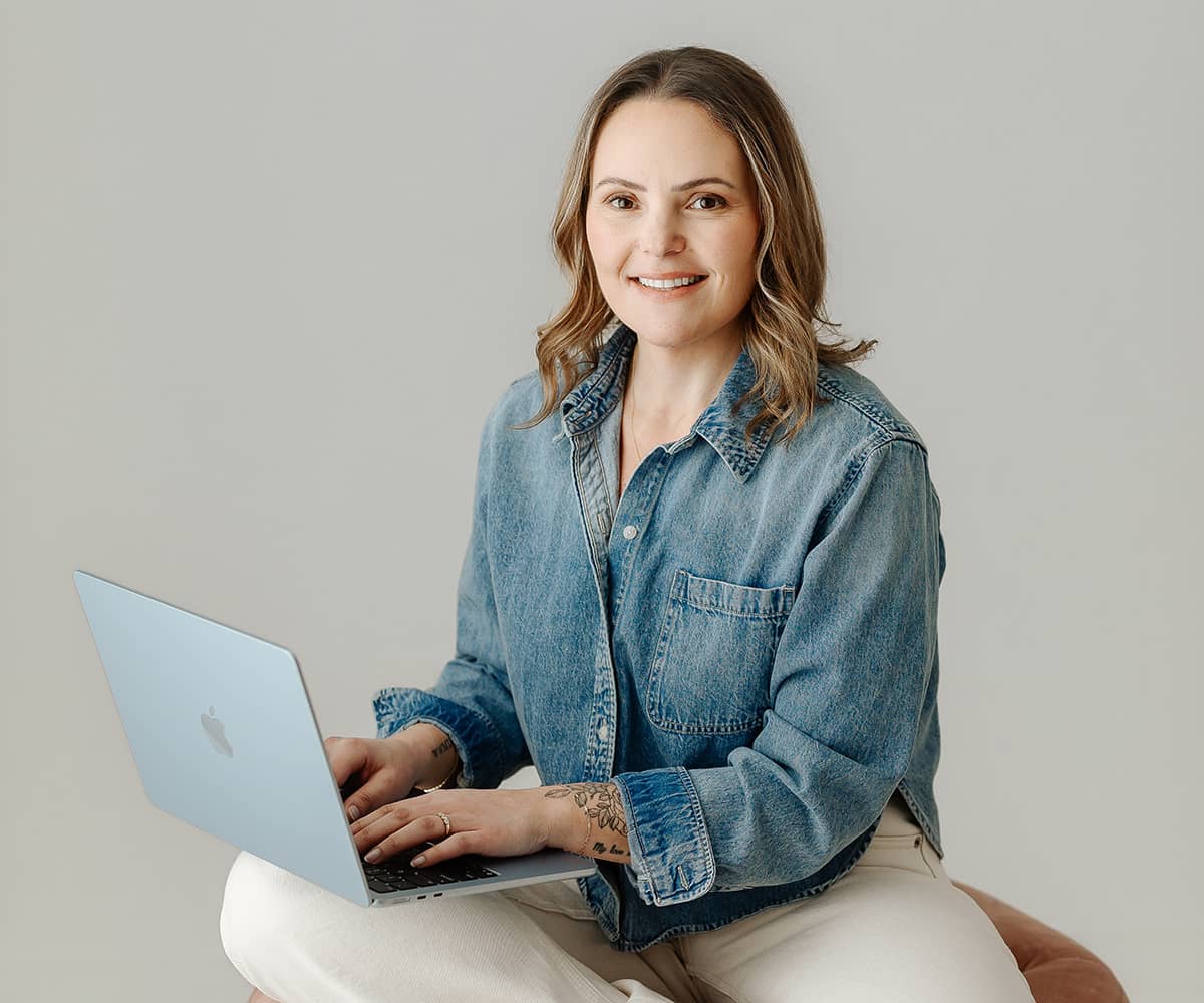 Marissa Esposito seated with her laptop, ready to hear from you
